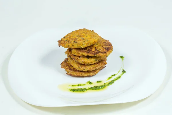 Zucchini pancakes on a white plate — Stock Photo, Image