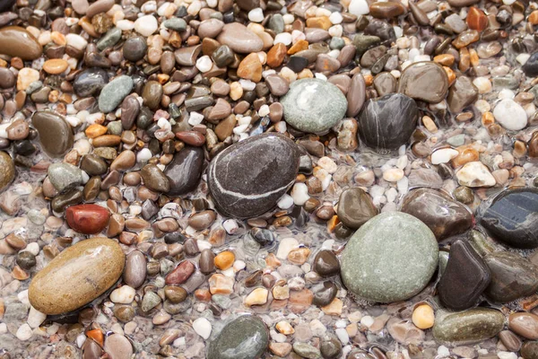 Havet pebble stenar bakgrund beach stenar — Stockfoto