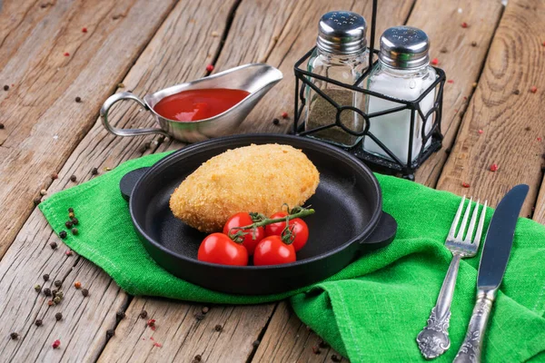 Chicken Kiev with tomatoes on a plate — Stock Photo, Image