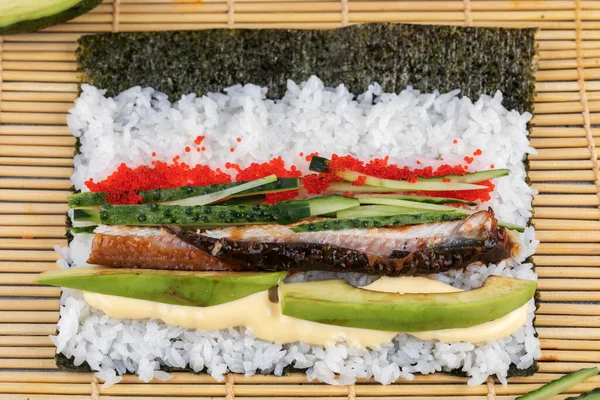 Making Rolled Sushi in a bamboo Sushi Mat — Stock Photo, Image