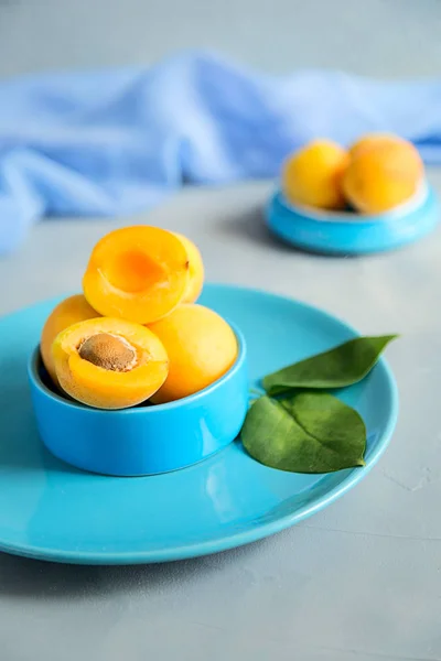 Fresh and ripe apricots on grey background. Season berries, summ — Stock Photo, Image