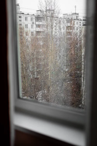 Snowy weather through the window in winter — Stock Photo, Image