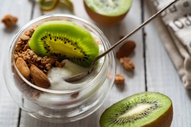 Healthy organic light breakfast. Cereal granola, yogurt and kiwi