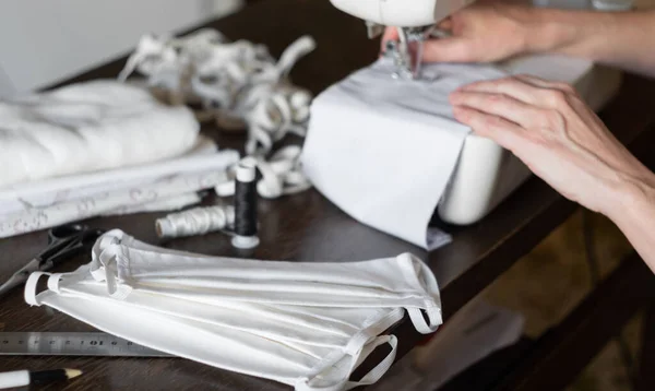 Female Volunteer Sews Protective Antivirus Masks Sewing Machine Home — Stock Photo, Image