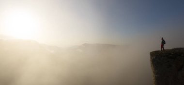 man on the edge of the cliff with the sun at dawn, Balcon de Pilatos, Sierra de Urbasa, Navarra
