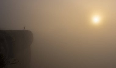 man on the edge of the cliff with the sun at dawn, Balcon de Pilatos, Sierra de Urbasa, Navarra clipart