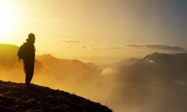 man on the edge of the cliff with the sun at dawn, Balcon de Pilatos, Sierra de Urbasa, Navarra