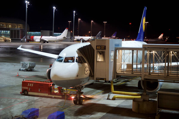 OSLO, NORWAY - JAN 21st, 2017: Lufthansa Airbus A320 airplane at the gate ready for boarding, early in the morning during winter