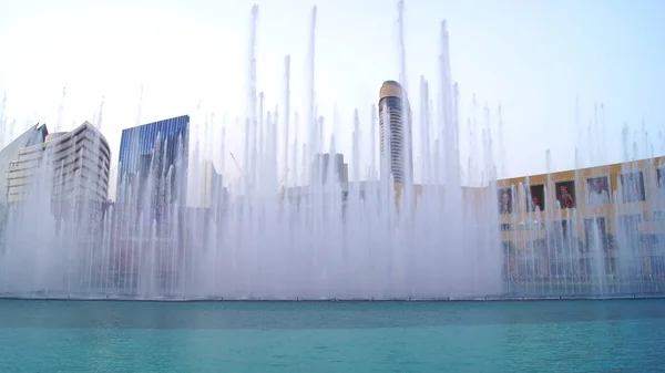 DUBAI, UNITED ARAB EMIRATES - MARCH 31st, 2014: The Dubai Fountain is the worlds tallest performing fountain in Downtown Dubai next to gigantic mall. The popular musical fountain of Dubai are one of — Stock Photo, Image