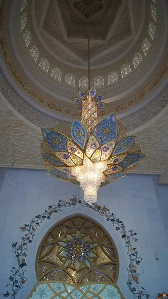 ABU DHABI, UNITED ARAB EMIRATES - APRIL 2nd, 2014: Interior design of Sheikh Zayad Mosque, Roof and chandelier inside the prayer hall Royalty Free Stock Photos