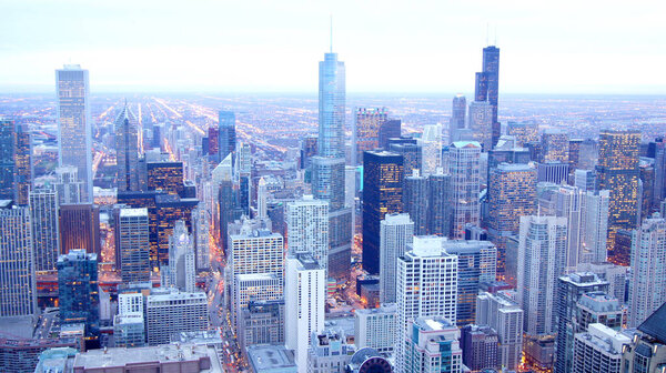 CHICAGO, ILLINOIS, UNITED STATES - DEC 11th, 2015: Aerial view of Chicago downtown at twilight from John Hancock skyscraper high above.