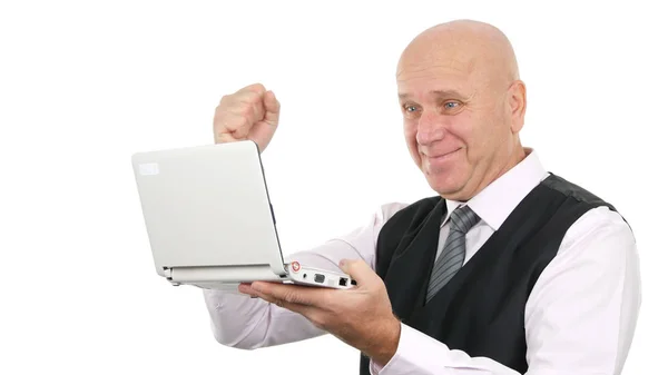 Businessman Smile and Read Good News on Laptop Making Happy Gestures — ストック写真