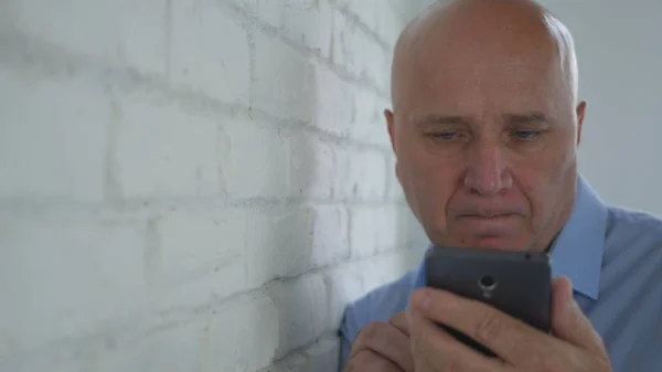 Image with a Disappointed Businessman Using a Cellphone00 — Stock Photo, Image