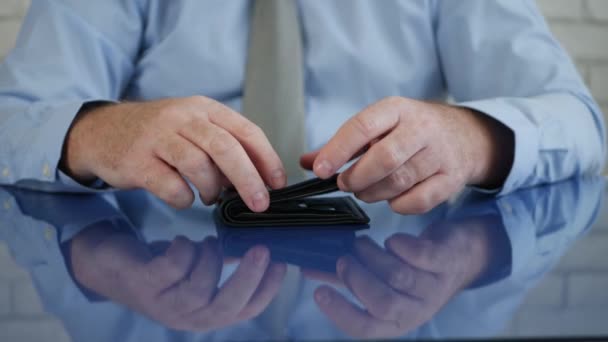 Upset Man with a Wallet in His Hand Takes Out a Credit Card to Make a Payment — Stock Video