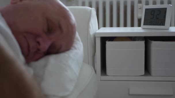 Tired Man Wakes Up from Sleep and Sets Off the Clock Alarm — Stock Video