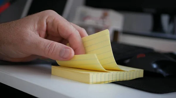 Businessman Browsing Small and Yellow Sticky Notes on Office Desk — Stockfoto