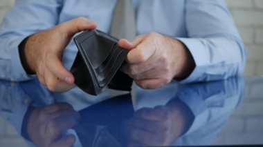 Desperate Businessman Showing His Empty Wallet, Insolvency in Payments, Financial Crisis and Bankruptcy, No Cash or Credit Cards