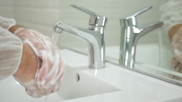 Man in the Restroom Washing with Soap and Water Cleaning and Disinfecting His Hands from Viruses — Stock Video