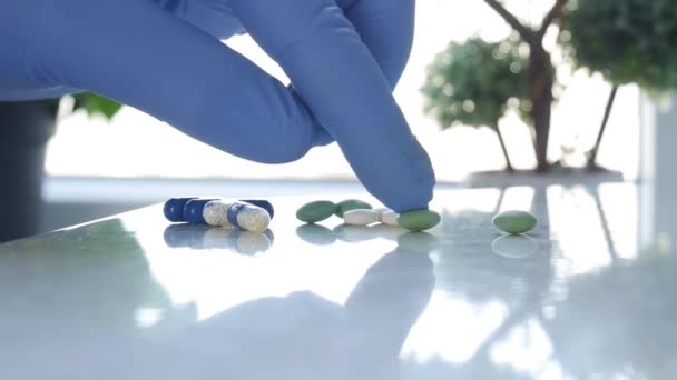 Slow Motion Doctor Hands Wearing Protecting Gloves Selecting Medical Pills for a Treatment in Hospital — Stock Video