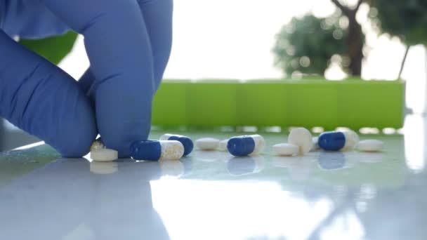 Doctor Hands Wearing Protecting Gloves Selecting Medical Pills for a Treatment in Hospital — Stock Video