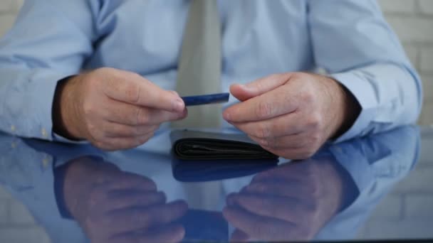 Upset Businessman Making Nervous Gestures with a Credit Card in Hand — Stock Video