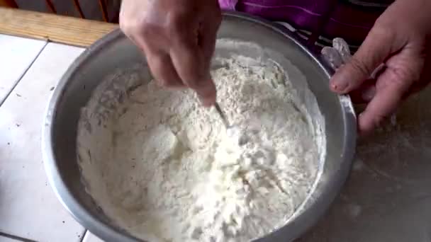 Mixing the dough in a metal bowl — Stock Video