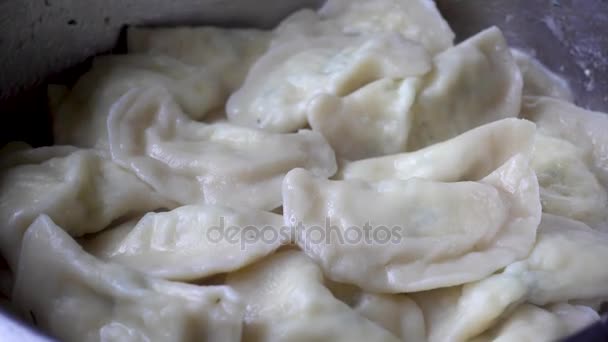 Boiled dumplings in a metal bowl. — Stock Video