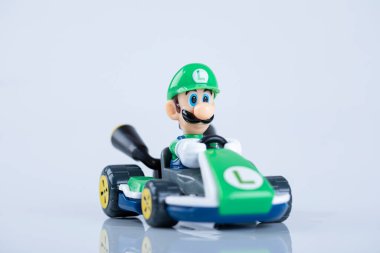 Mario Kart 8 Deluxe. Video game on a Nintendo switch. Luigi in the car. clipart