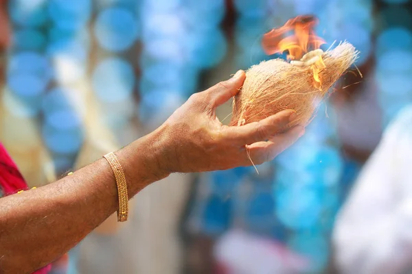 Marriage Pooja Praying at Hindu Tamil Traditional Wedding Rituals with colorful lights background.