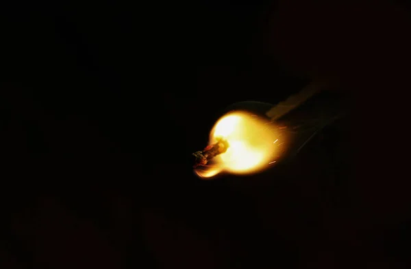 Macro fire burning on matchstick. Studio shot isolated on black background. — Stock Photo, Image