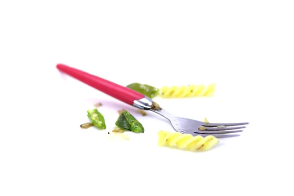 Pasta met vork en groene chili op witte achtergrond — Stockfoto