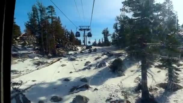 Point of View from inside a Heavenly cabin lift going up a snowy mountain on a ski resort 25th Dec 2018 California USA — Stock Video