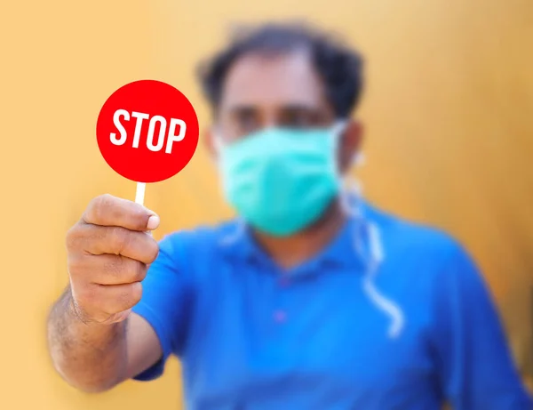 Stop the infection! Healthy man showing gesture \