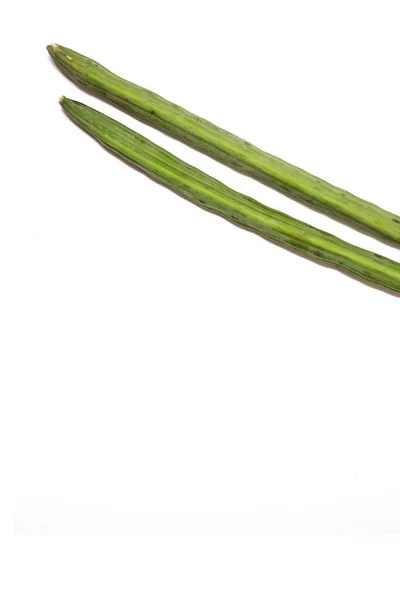 Drumstick vegetable in isolated background.slender drumsticks vegetables