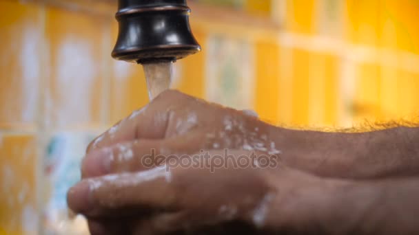 Slow motion closeup of a man washing his hands throughly with soap — Stock Video