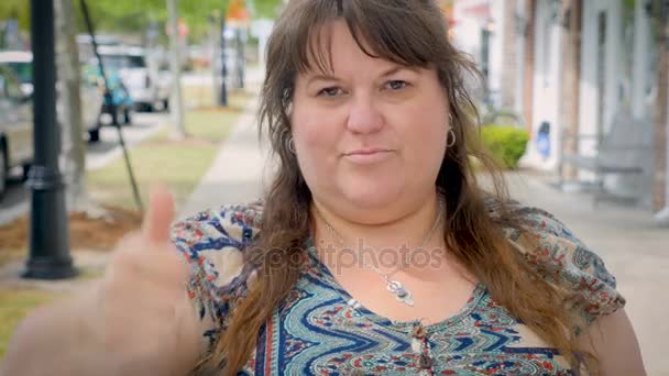 Disappointed frustrated full figured woman gives the thumbs down — Stock Video