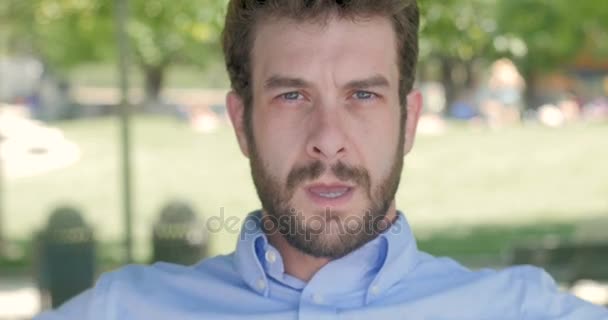 Close up portrait of attractive man in 30s giving two thumbs down — Stock Video