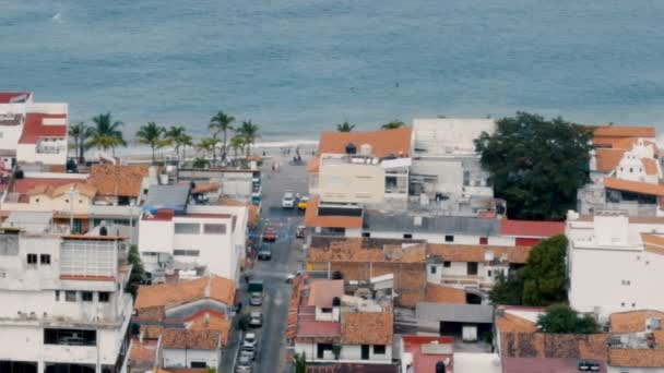 Pan of the ocean and beach above the old historic city of Puerto Vallarta Mexico — Stock Video
