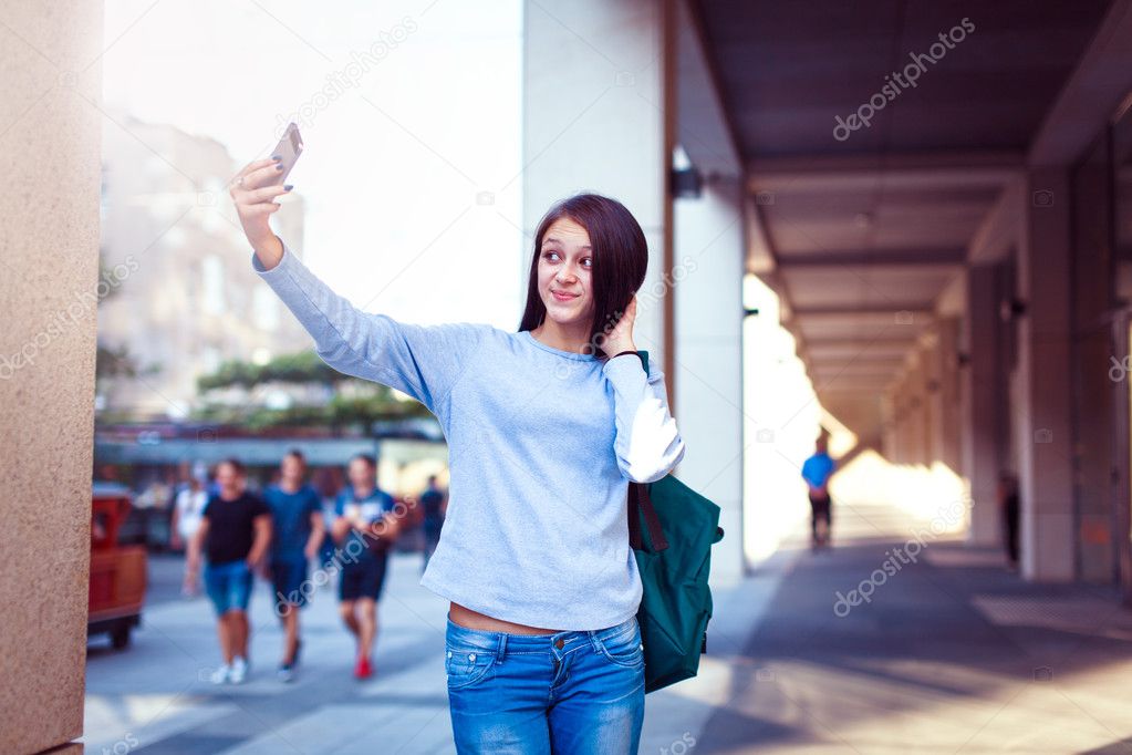 Students Walking Outdoors On University Campus