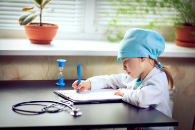 Cute little girl doctor on her rounds clipart