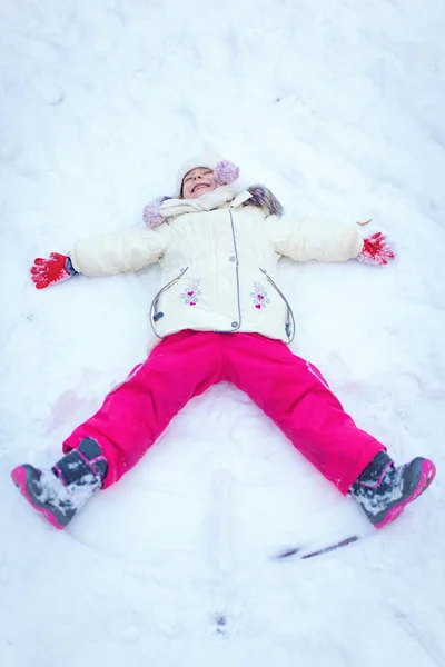 Adorable little girl having fun on winter day — Stock Photo, Image