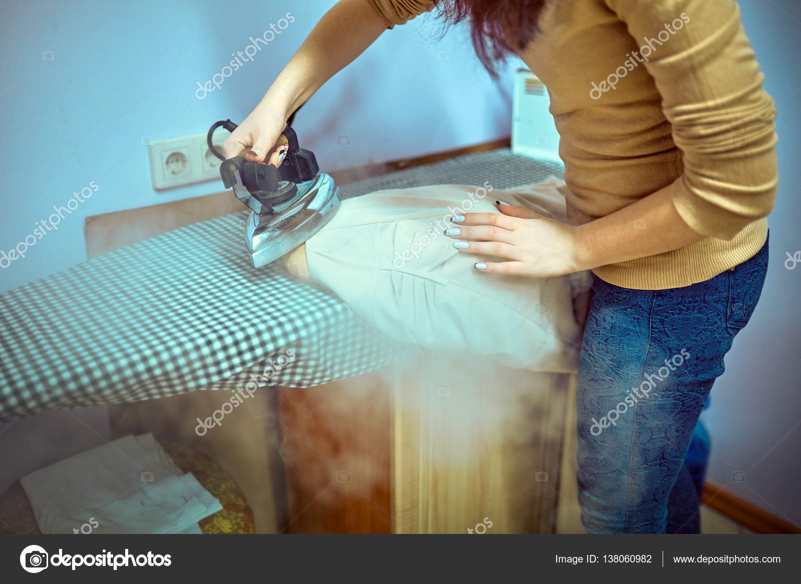 Premium Photo  Woman ironing cloth on board closeup