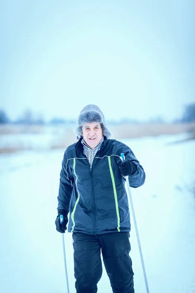 Senior at the cross-country skiing in winter — Stock Photo, Image