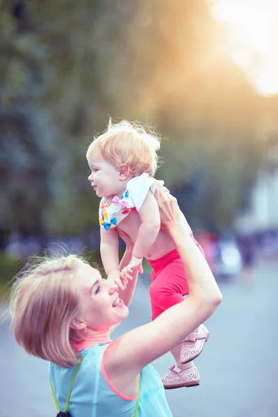 Happy family having weekend in summer park — Stock Photo, Image