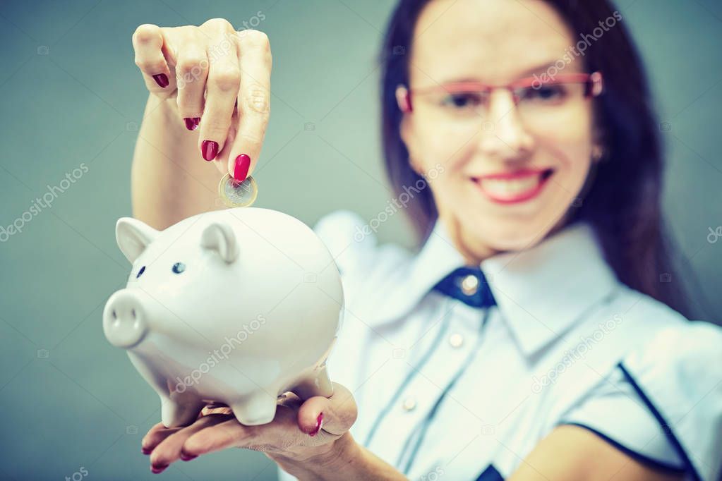 Piggy bank savings woman smiling happy