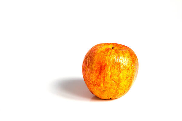 Wizen apple presented as old aging skin