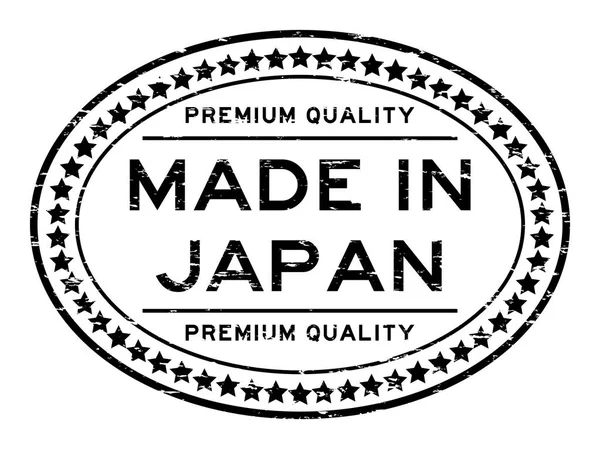 Grunge black premium quality made in Japan with start icon oval — Stock Vector