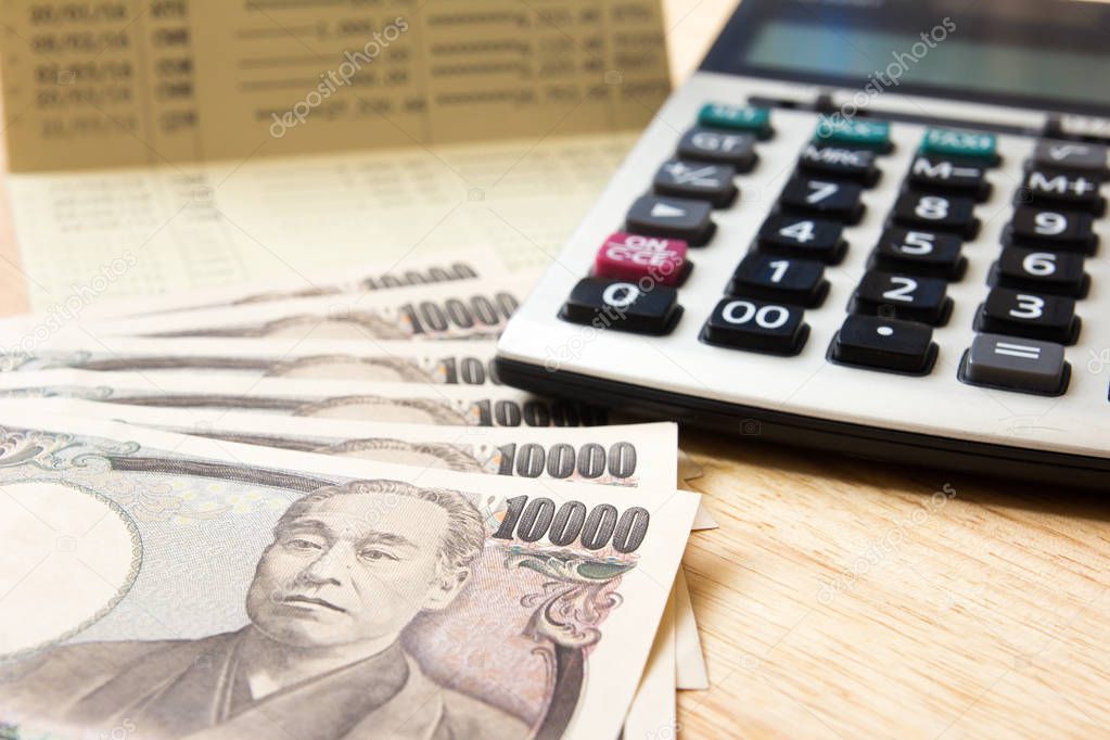 Saving account passbook, japanese yen, calculator 