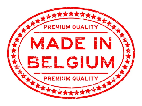 Grunge rojo de primera calidad hecho en Bélgica con estrella icono sello de goma ovalada — Archivo Imágenes Vectoriales