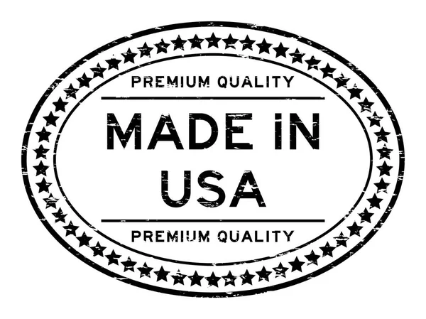 Grunge svart premiumkvalitet tillverkad i Usa oval gummi sigill stämpel på bäver bakgrund — Stock vektor